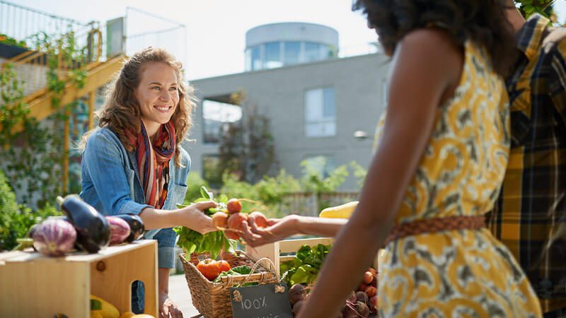 A person shopping at a farmers' market