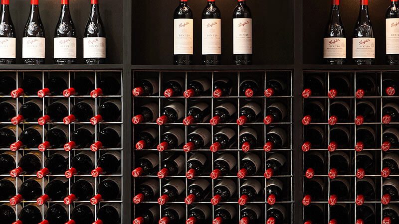 Bottles of Penfolds Grange wine in a wine rack