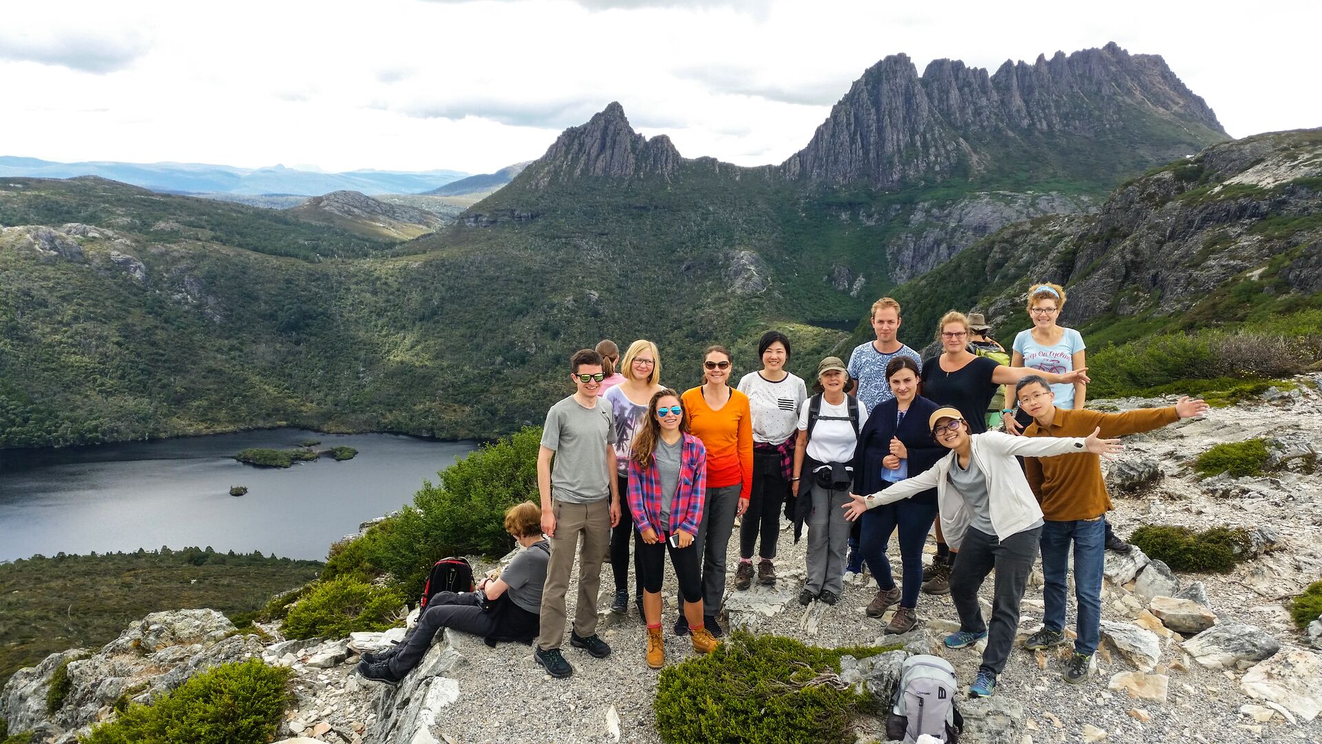 A group poses at Marions Lookout in Cradle Mountain
