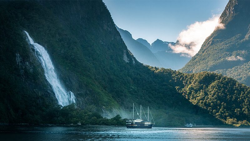 A cruise ship docked near Bowen Falls in Milford Sound