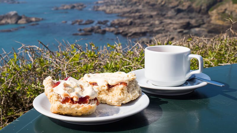 A Cornish cream tea with a view of the coast