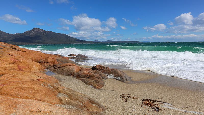 Waves crashing into the shore at Hazards Beach