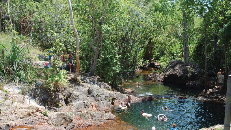 A group of travellers swimming in a watering hole in Litchfield National Park. 