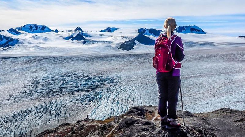 Hiker overlooking an ice field