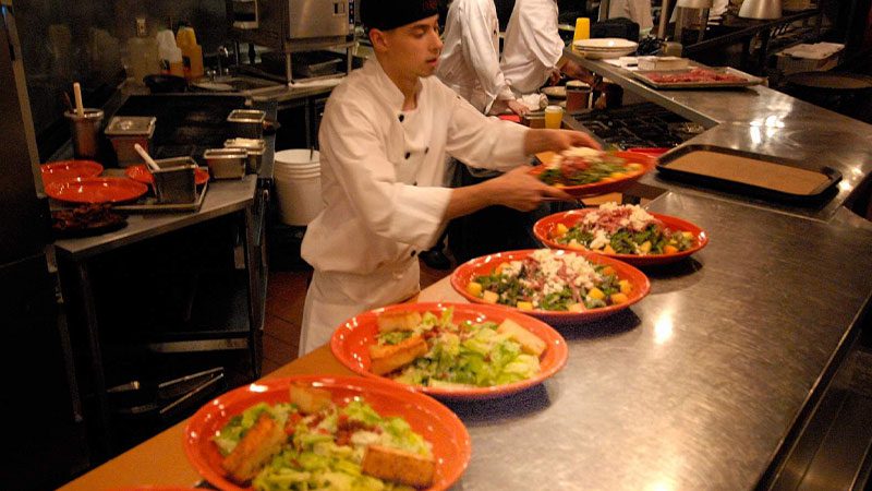 Chefs preparing meals in the kitchen at ORSO in Anchorage