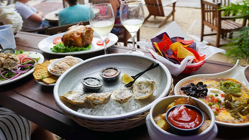A restaurant table filled with delicious food in Key West