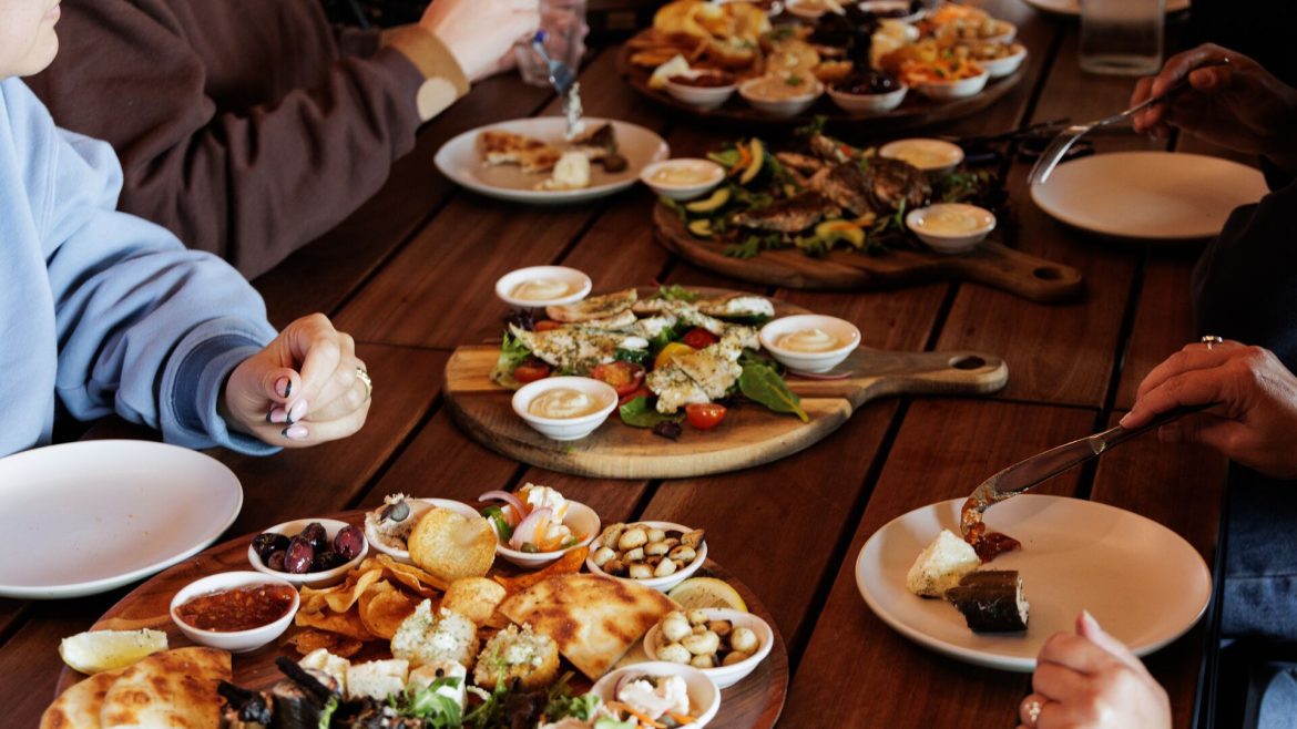 People sit at a café eating traditional Australia bush foods on a Bush Foods experience in Melbourne