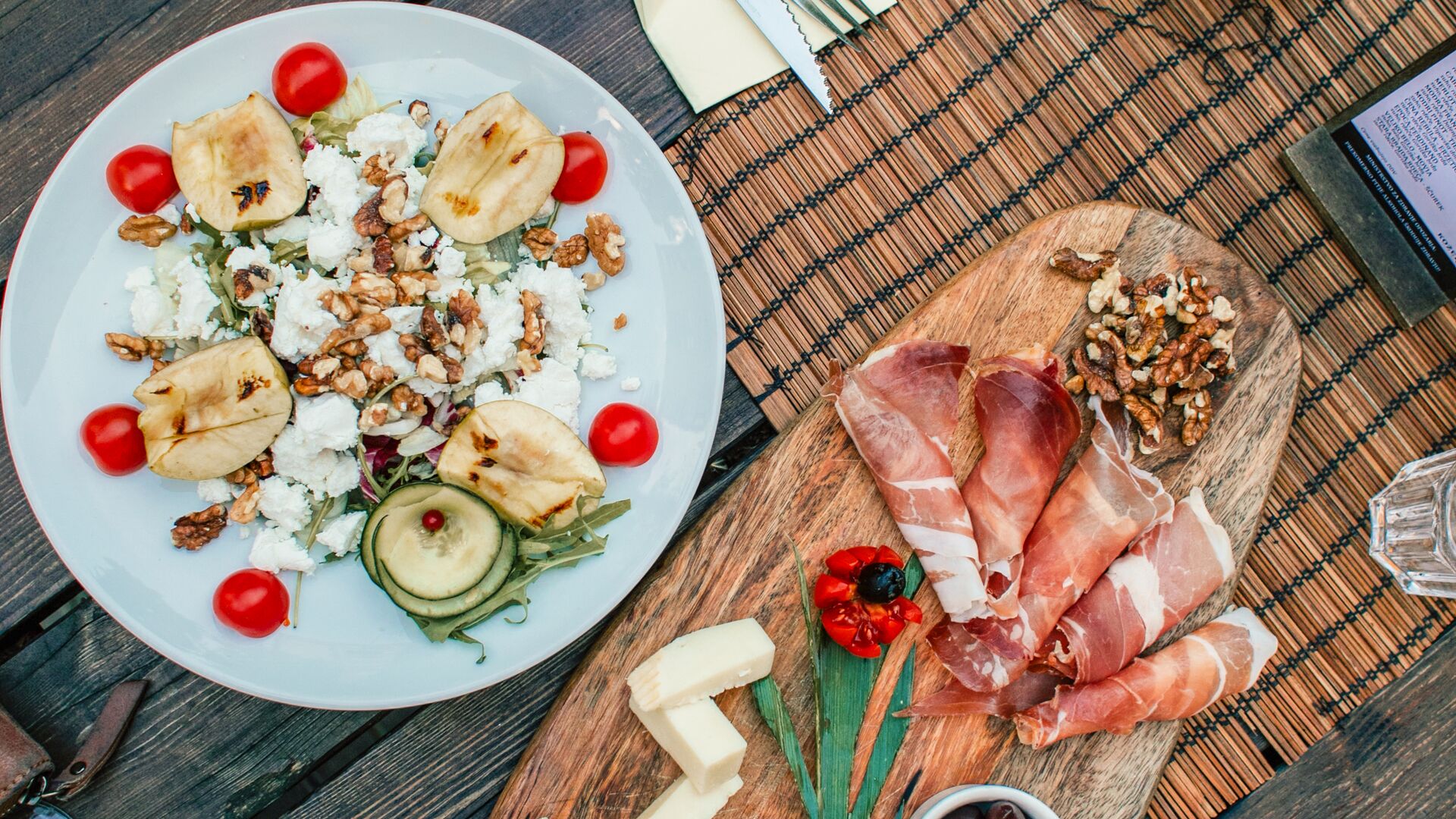 A spread of classic Slovenian appetiser dishes, including cold cuts and cheese