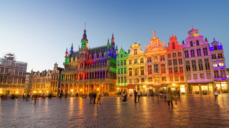 Bright neon lights lighting up old buildings in Brussels