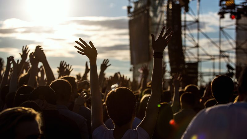 People dancing at a music festival