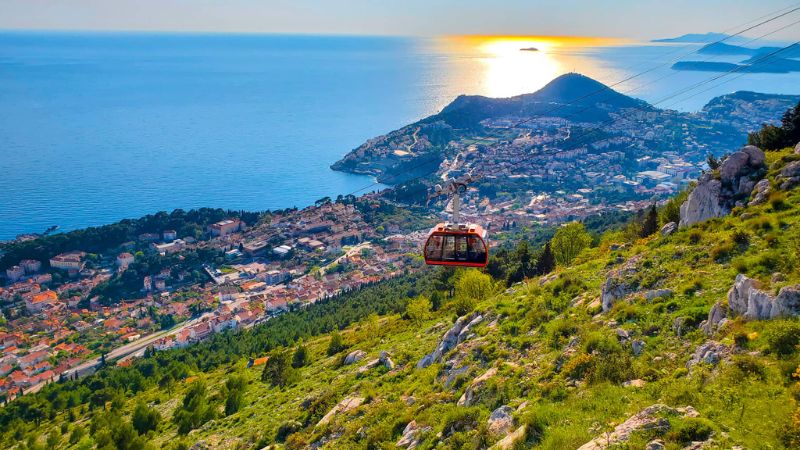 A cable car makes its way over hills in Croatia