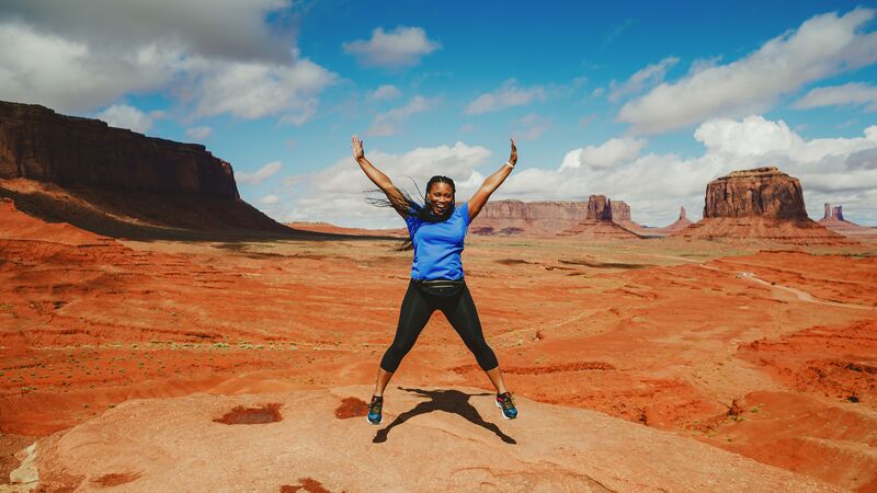 A woman jumping in Monument Valley, Arizona