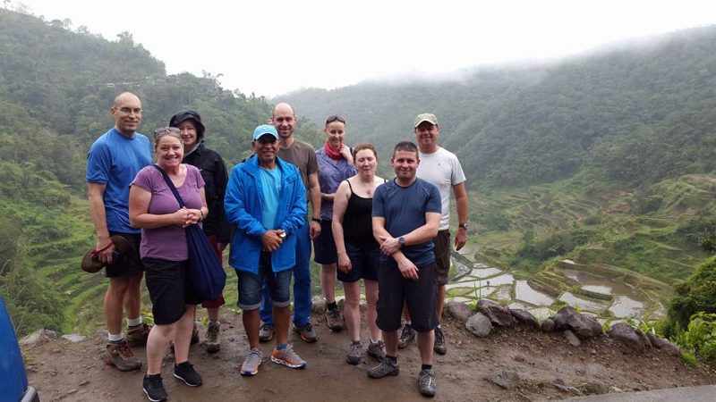 A group of travellers standing on a misty mountain