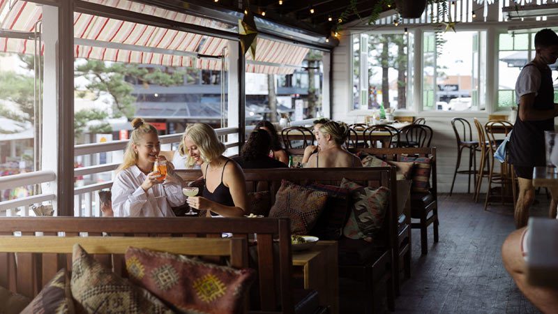 People enjoying the balcony of Balcony Bay & Oyster Co.