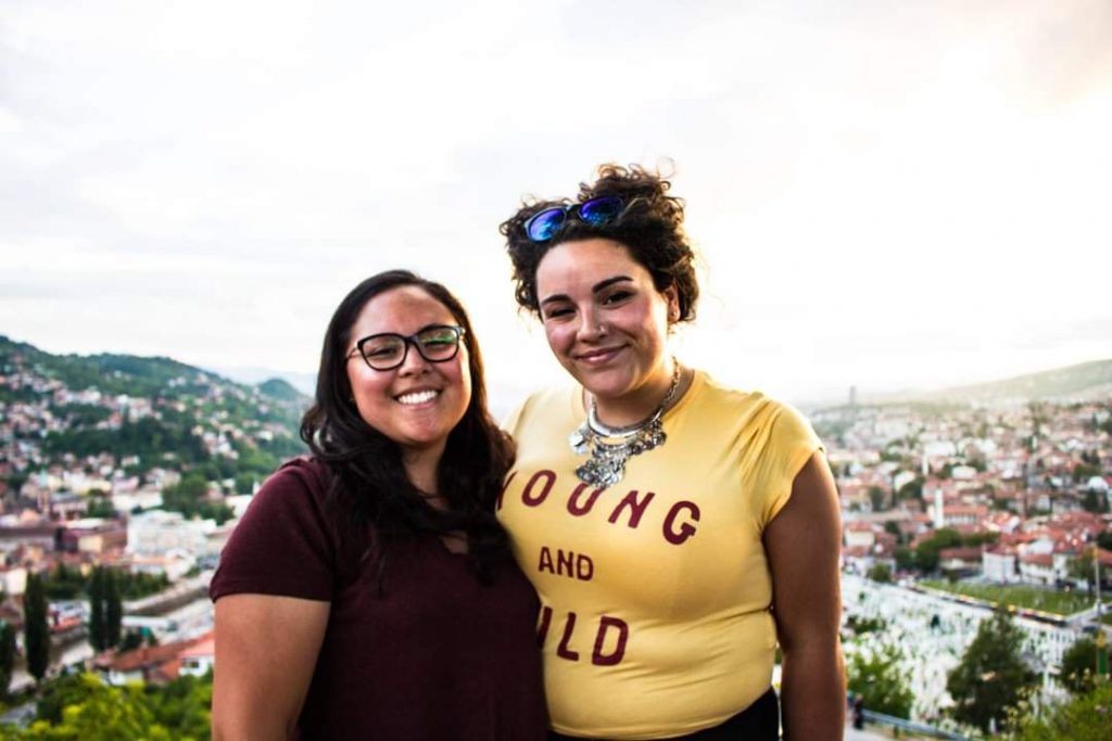 Two smiling women on holiday in Europe