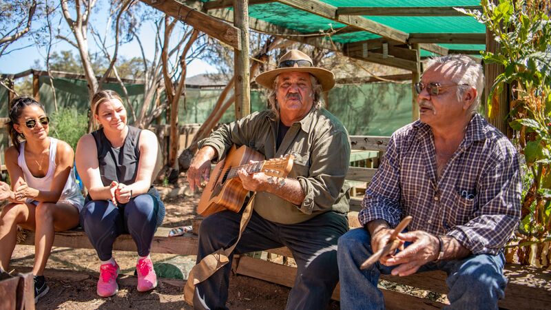 Two Aboriginal elders performing a song as part of a First Nations experience in South Australia.