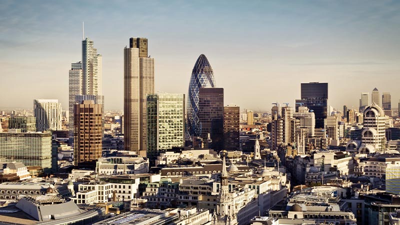 The city skyline of London with towering skyscrapers and historic buildings. 