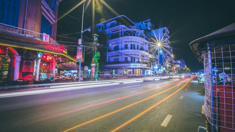 The neon lit streets of Phnom Penh in Cambodia.