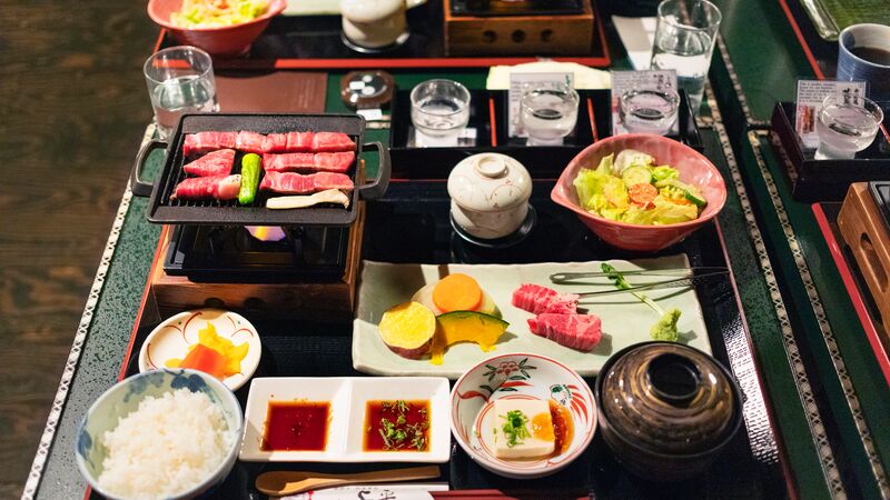 A selection of small and colourful dishes presented as dinner in Japan