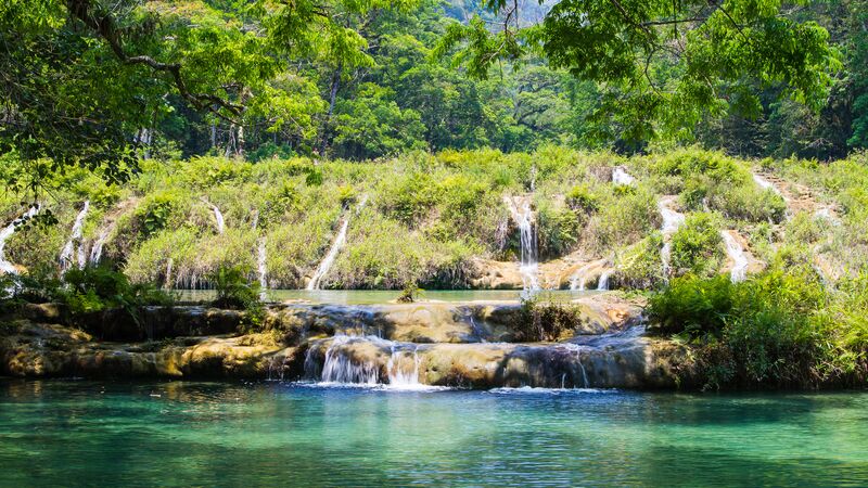 The tiered natural pools of semuc champey with cascading water. 