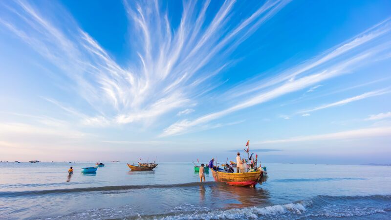 Local fishermen mooring up on a beach in Vietnam