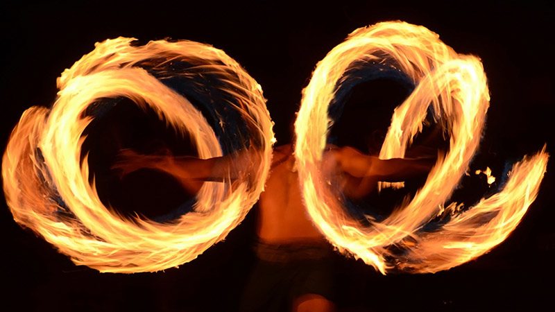 Traditional Samoan fire dancing at a fiafia night