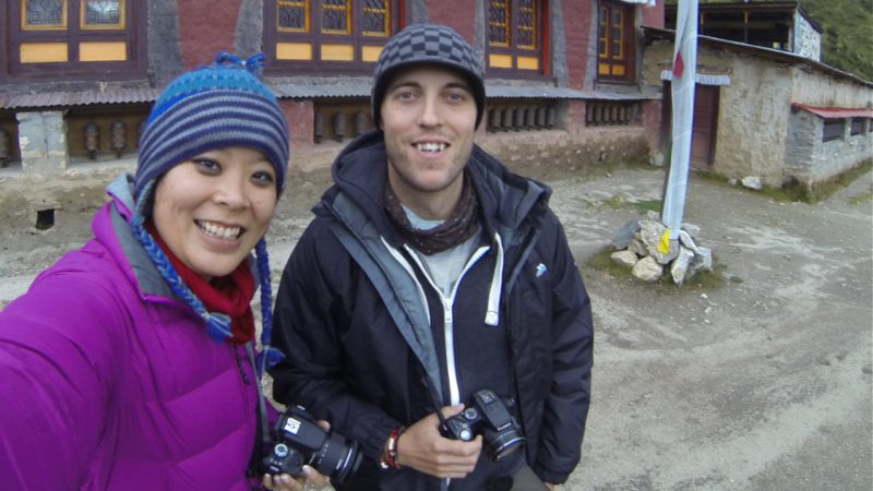 A couple pose for a selfie outside Phortse Temple in Nepal
