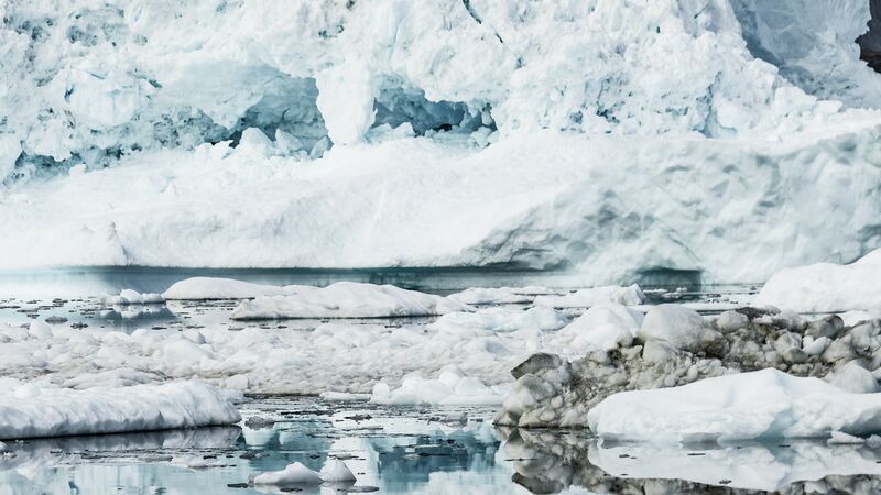 A collection of floating icebergs in Greenland