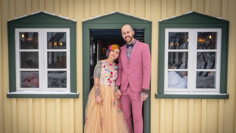 Two Intrepid travellers smiling on their wedding day in Iceland.