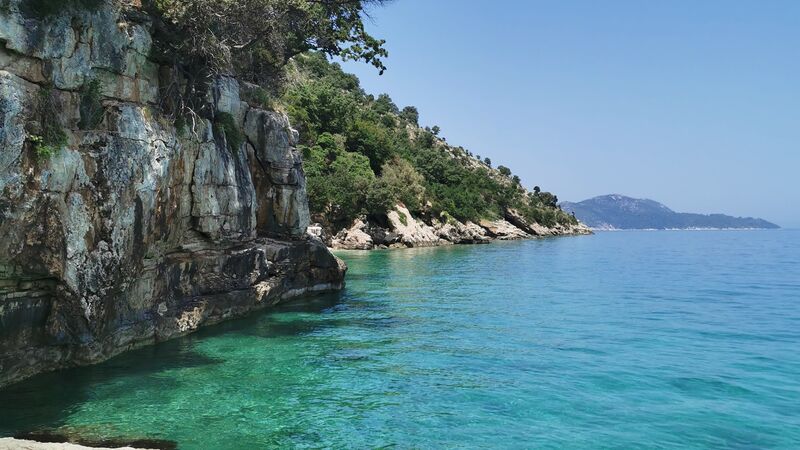 The azure waters and rocky cliff faces off the coast of Albania.