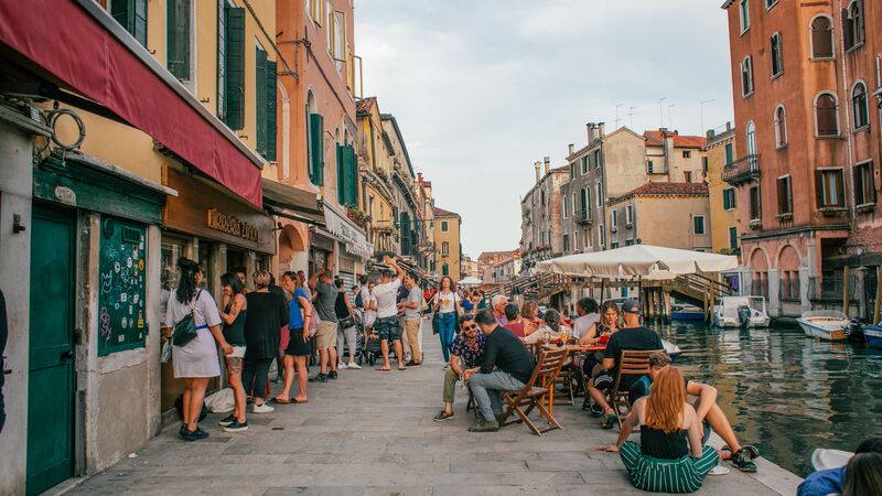 A busy canalside bar in Venice, Italy