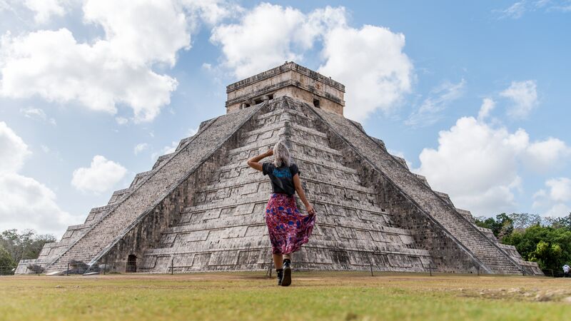 A traveller walking towards Chichen Itza in Mexico