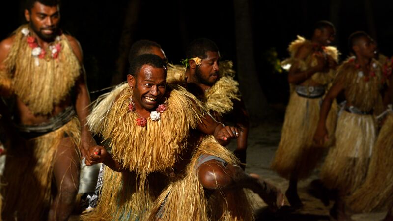 Male Fijians traditionally dancing, Fiji