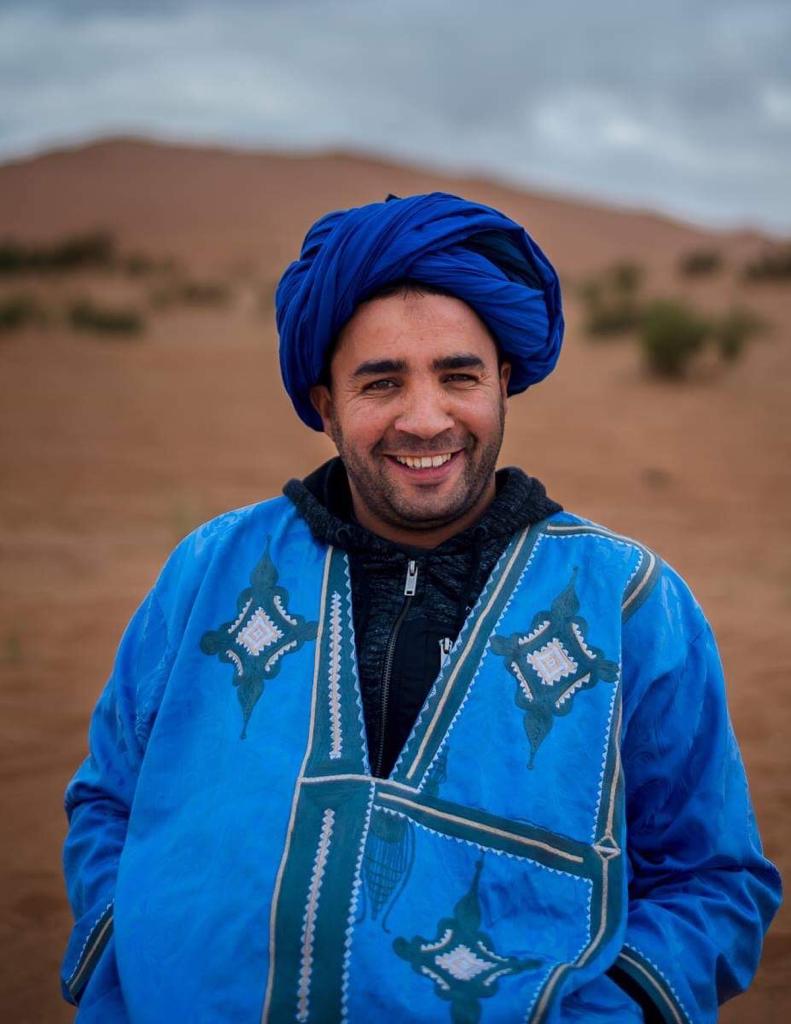 Hamid Oumezdou smiling in the Sahara