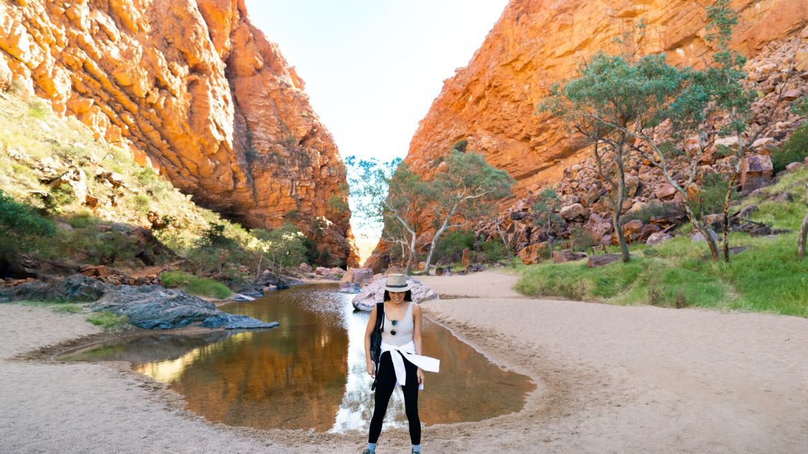 Lifestyle influencer, Sarah, poses in a gorge in the Northern Territory