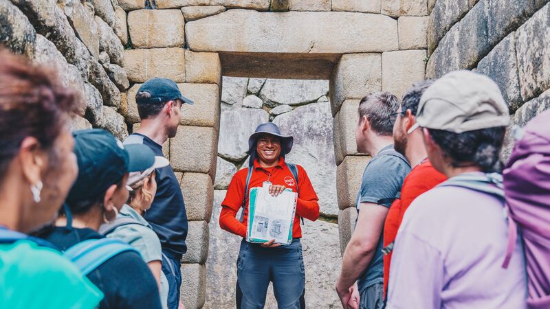 Intrepid leader talking to his group in Machu Picchu. 