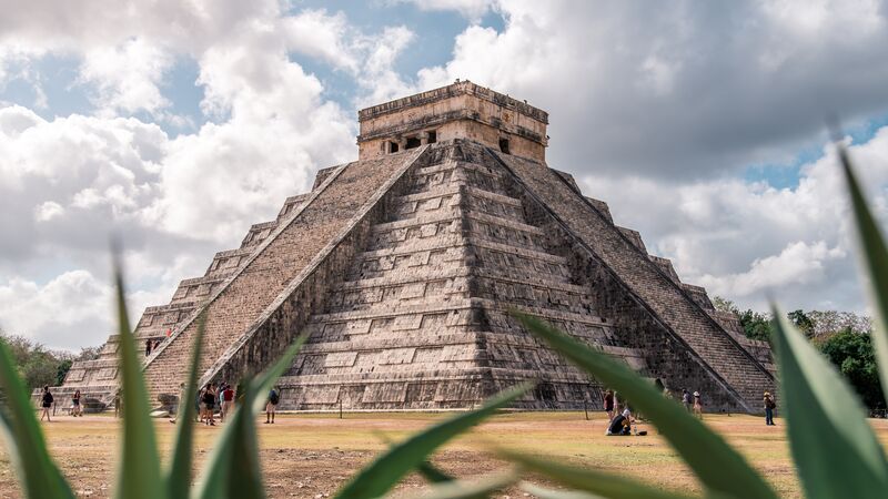 The impressive structure of Chichen Itza on a cloudy day in Mexico