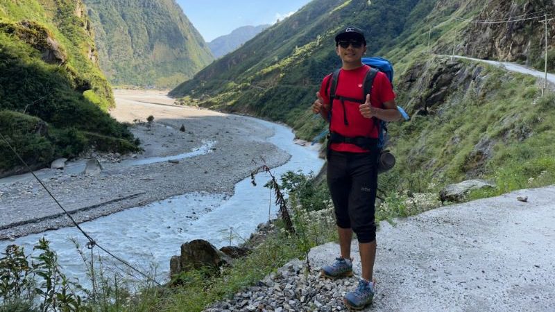 Phurba Sherpa, Intrepid leader, gives the camera a thumbs up during a walk in the Himalayas