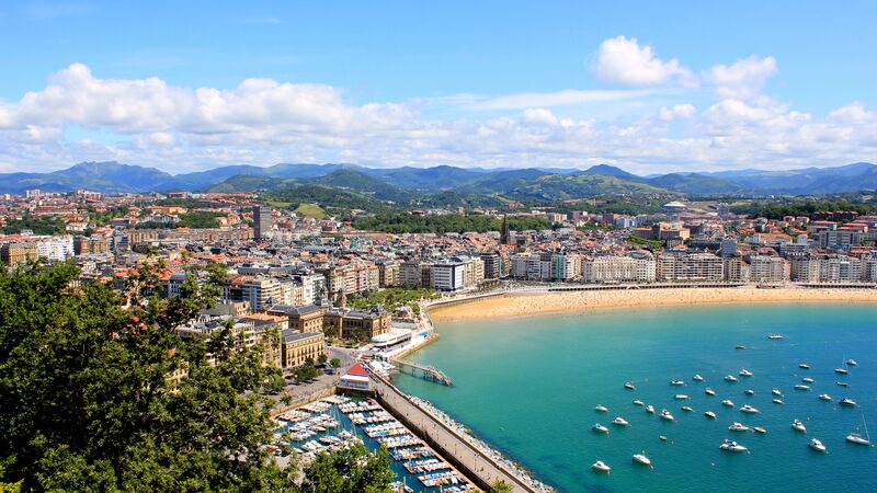 Aerial view of the beach and bay area of San Sebastian and surrounding town.