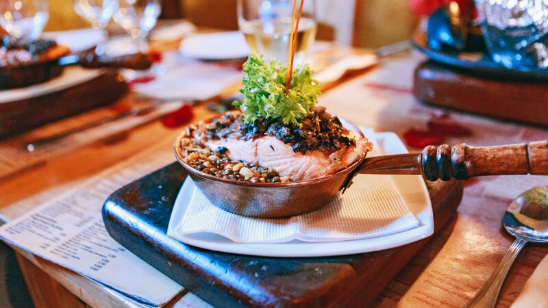 A pan full of perfectly cooked quinoa and pink salmon, served at a restaurant in Chile. 