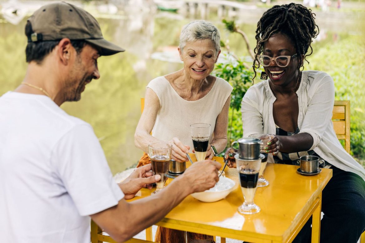 a group of travellers drinking egg coffee in vietnam