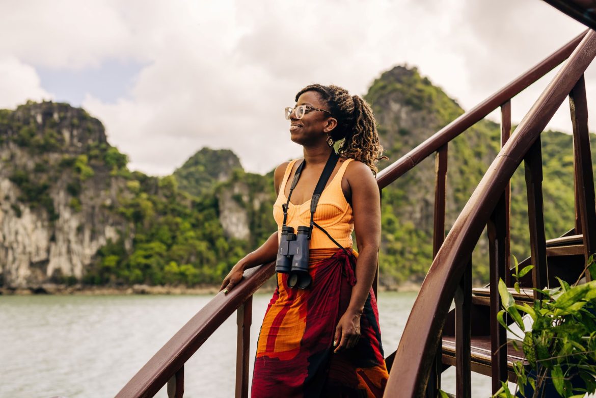 a woman with binoculars in a national park