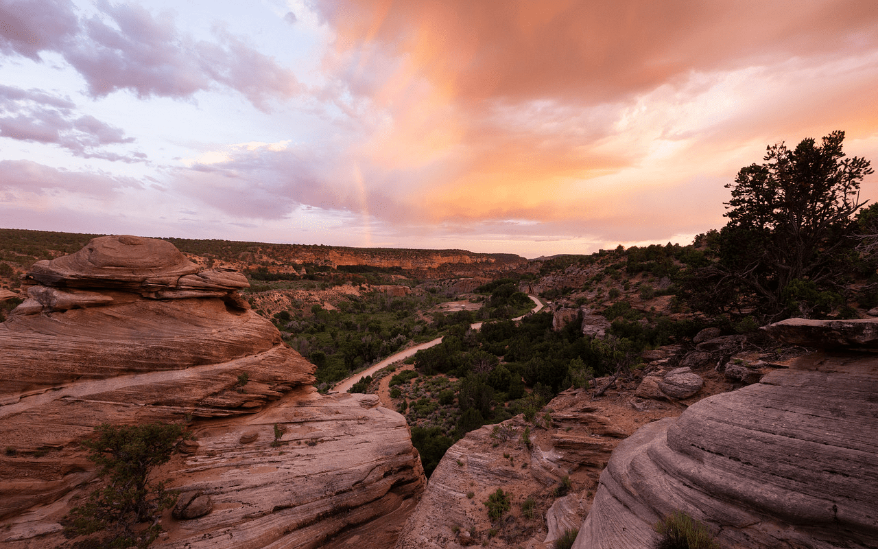 a sunset over a red canyon