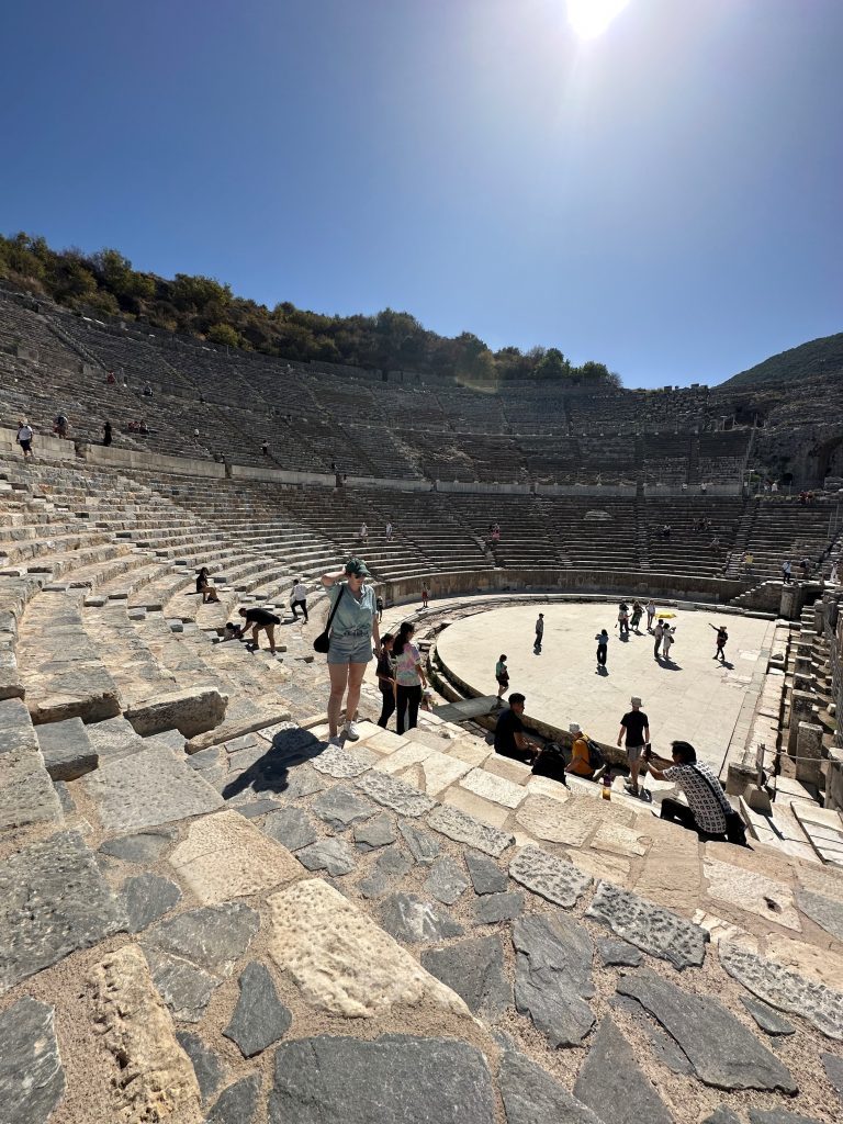 Woman standing in the Great Theatre at Ephesus, Turkey