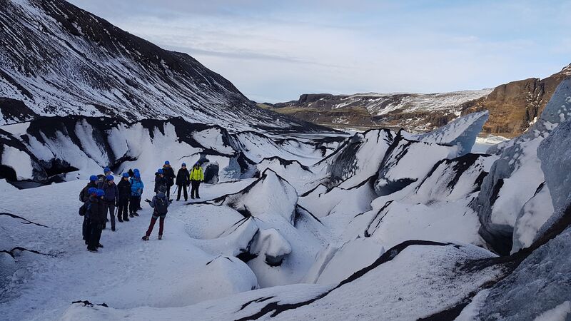 excursions to iceland Hikers on the Solheimajokull Glacier-