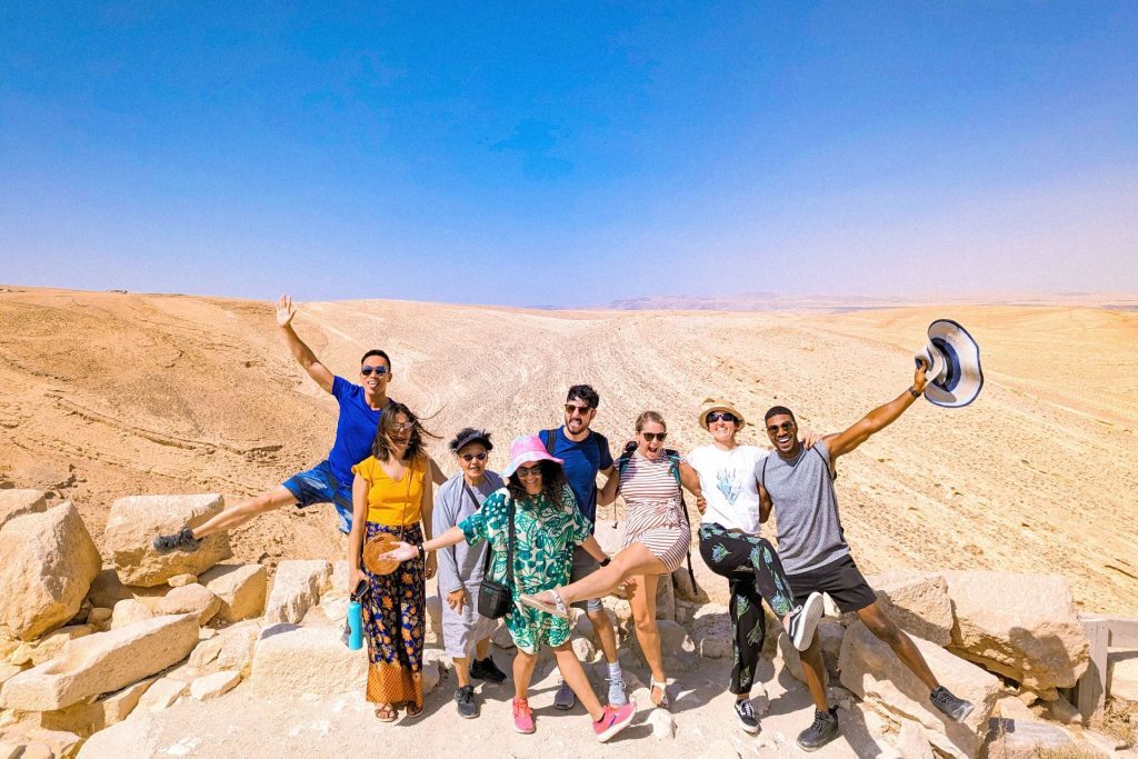 a group of travellers in the desert 