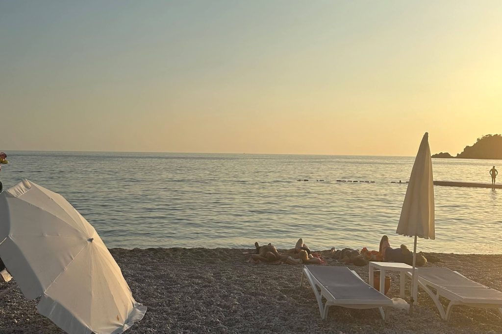 Sunbathers by the water on the Oludeniz Beach