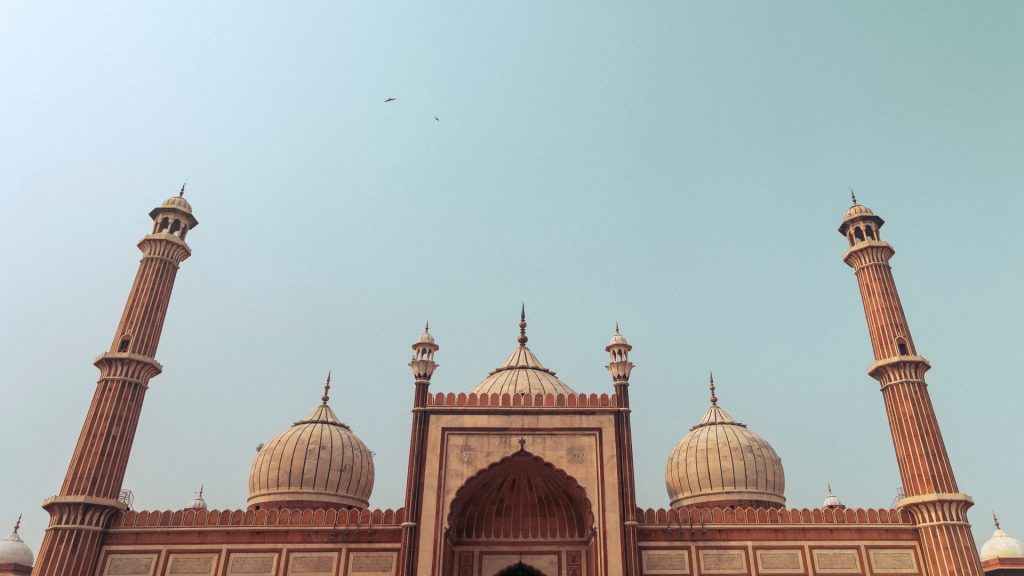 The imposing structure of Jama Masjid in Delhi under a blue sky