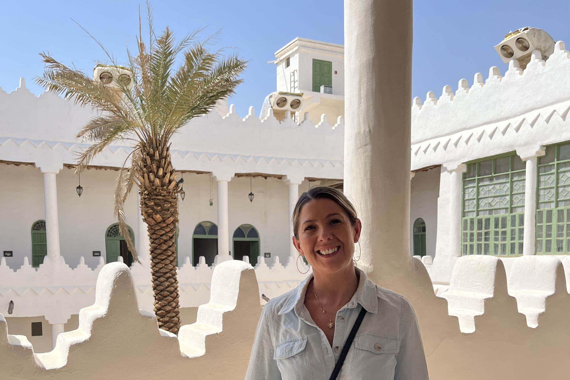 A woman standing in an ornate white building