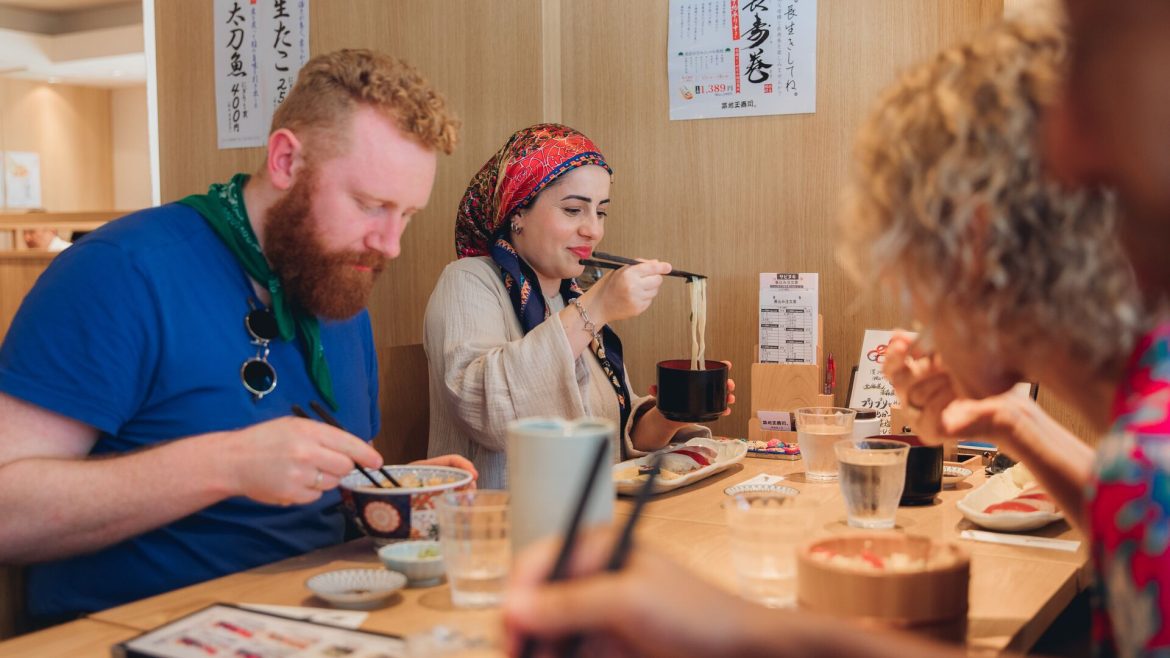 A group of Intrepid travellers eating lunch in Japan